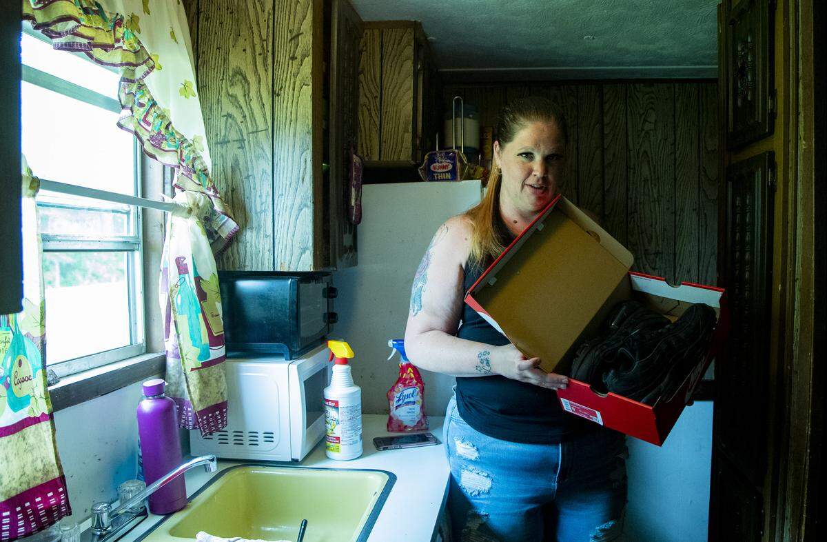Jessica Fipps holds a new pair of Nike sneakers she received for her birthday Friday afternoon in Gallivants Ferry. Fipps has been out of work for nearly a motnh due to the COVID-19 coronavirus pandemic.