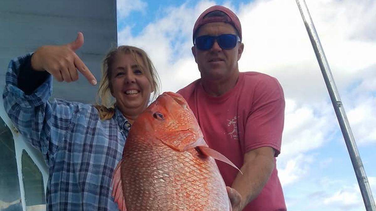 Amy Vincent and Capt. Robert Strickland show off a large red snapper caught aboard the New Inlet Princess out of Murrells Inlet.