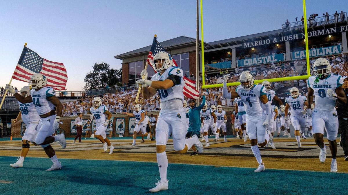 Coastal Carolina takes the field against Kansas on August 11 in front a school-record crowd of 17,697 at Brooks Stadium. Aug. 11, 2021.