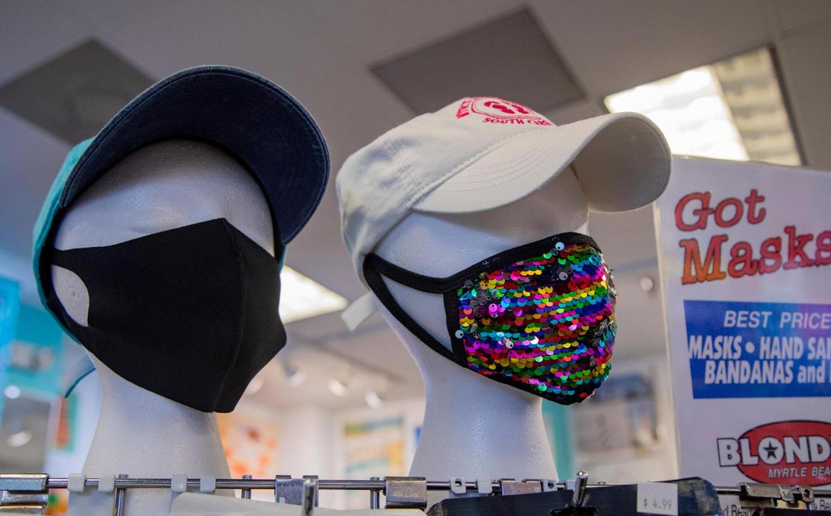 Masks sit on display at Blondie’s at the Tanger Outlets along Hwy. 501 in Myrtle Beach on Thursday afternoon.