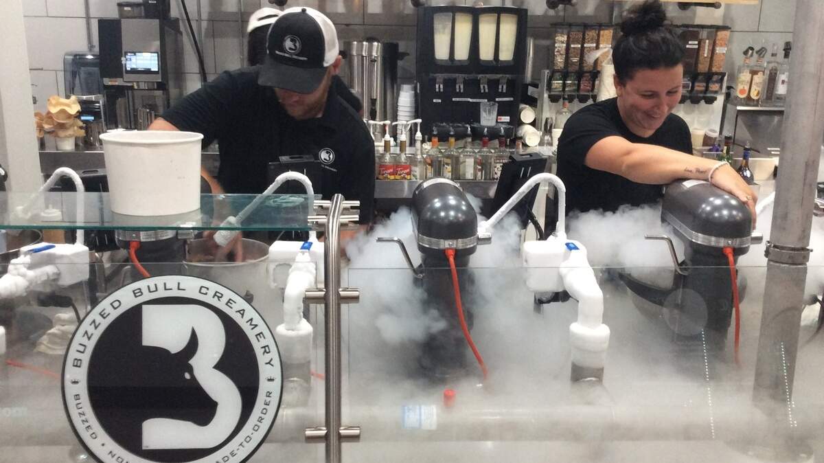 Buzzed Bull Creamery, featuring alcohol-infused liquid nitrogen ice cream, opened on South Kings Highway at 13th Ave. South in Myrtle Beach on July 27. Alex Flores (left) and his sister Becky Flores of Toms River, New Jersey, are the owners.