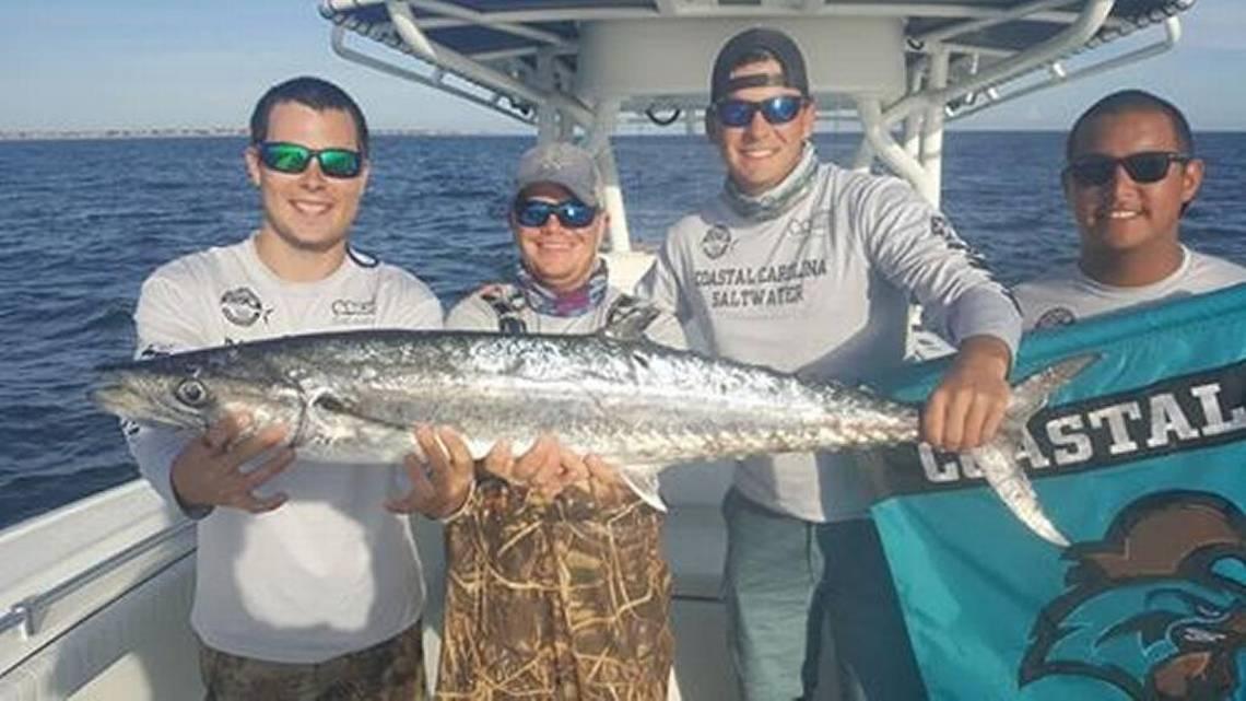 Members of Coastal Carolina University’s Saltwater Angler Club show off a nice king mackerel. submitted photo