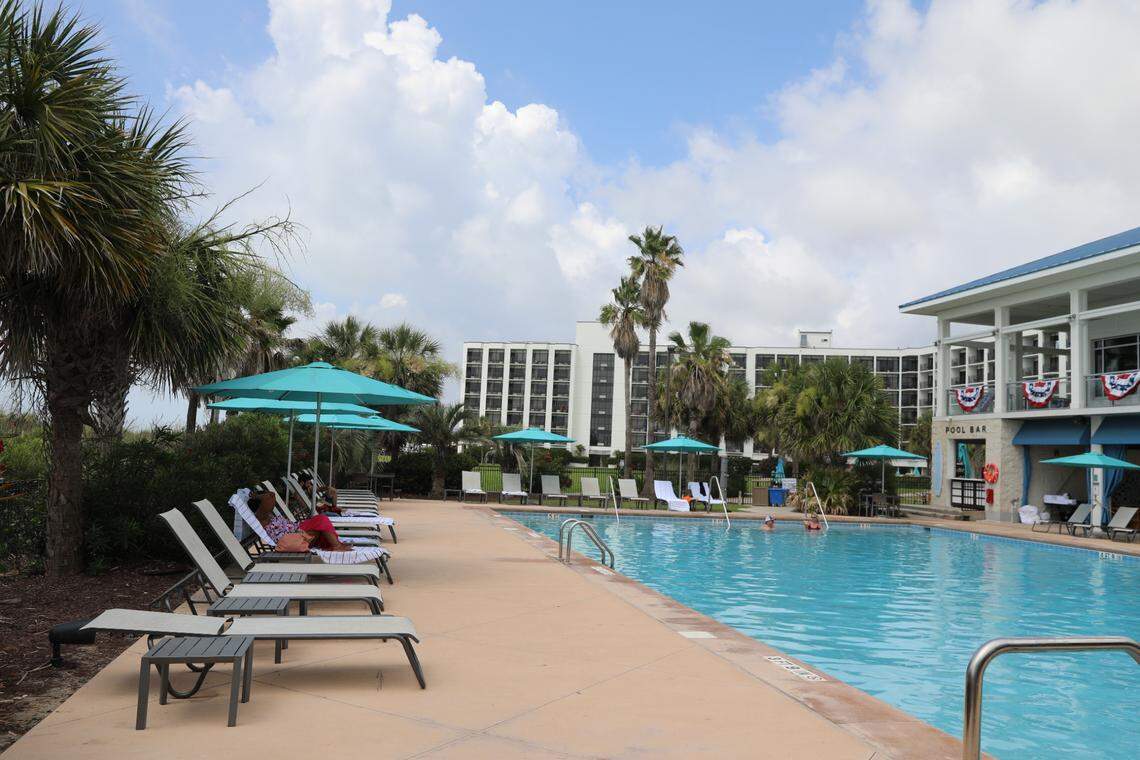 Guests lounge at the adults-only pool at The Ellie Beach Resort. The hotel was renovated in 2024 and 2025, with a new pool area being constructed and all hotel rooms getting a revamp. The name was also changed to reflect a historic Myrtle Beach figure. July 3, 2025