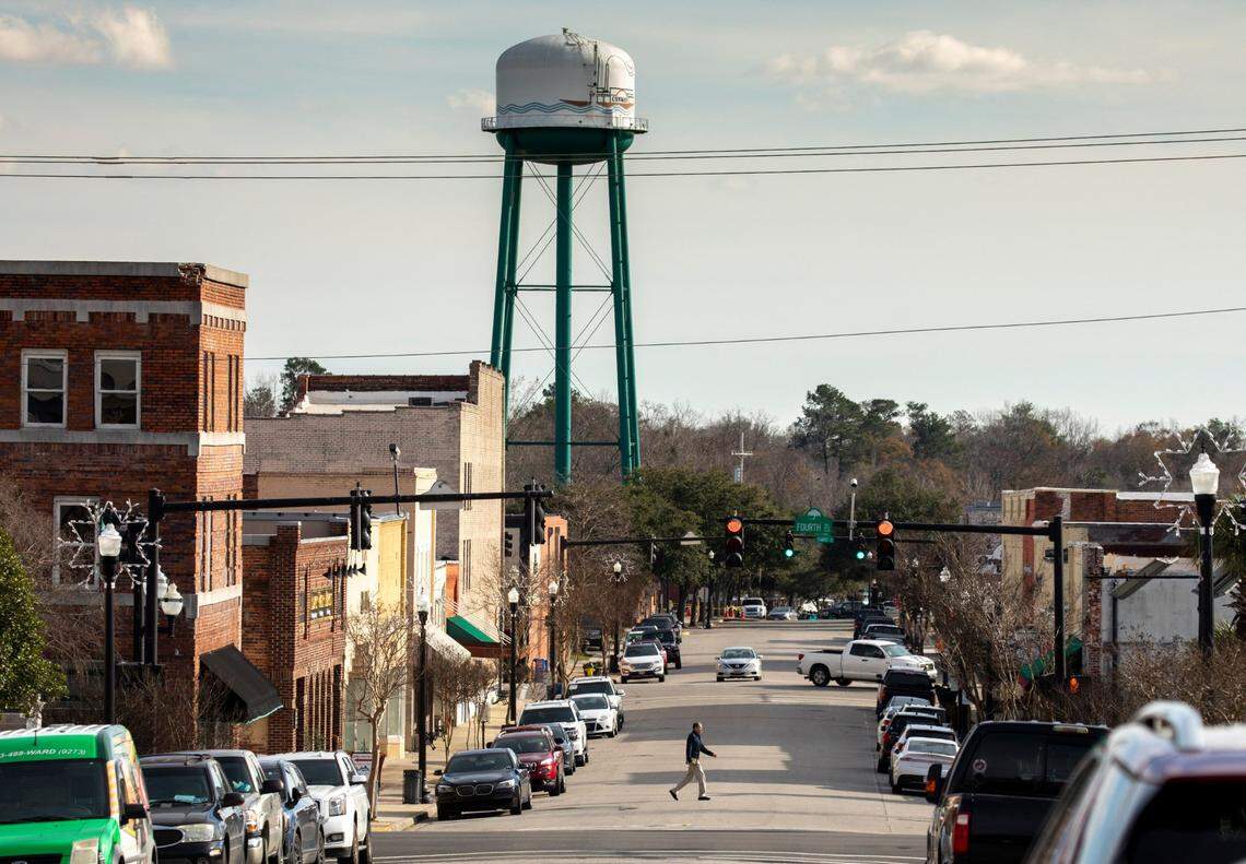 Conway file art January 2020. Images of Conway riverwalk, downtown, streets, trees, park, and bridge.