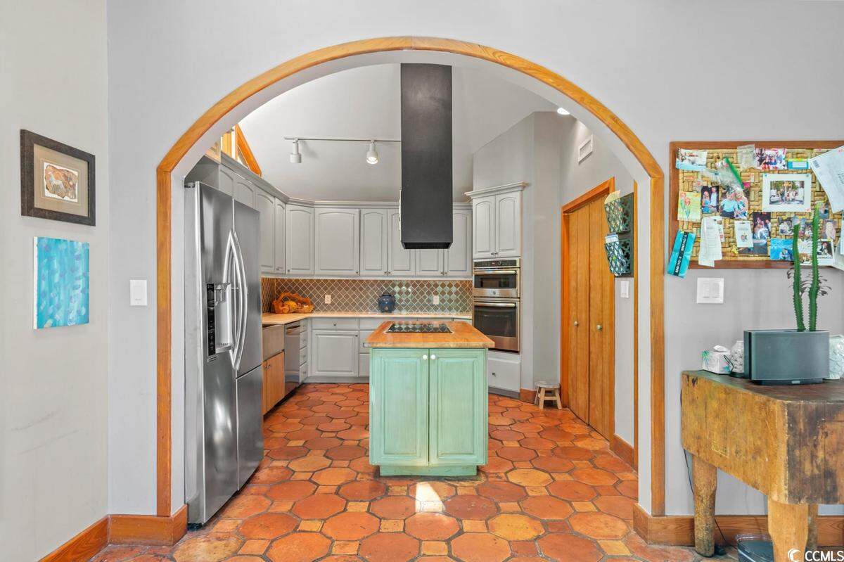 A home surrounded by trees and overlooking the Intracoastal Waterway near North Myrtle Beach is listed for $825,000. Built in 1979, the house has three bedrooms and a dock. Provided photo. Dec. 12, 2023.