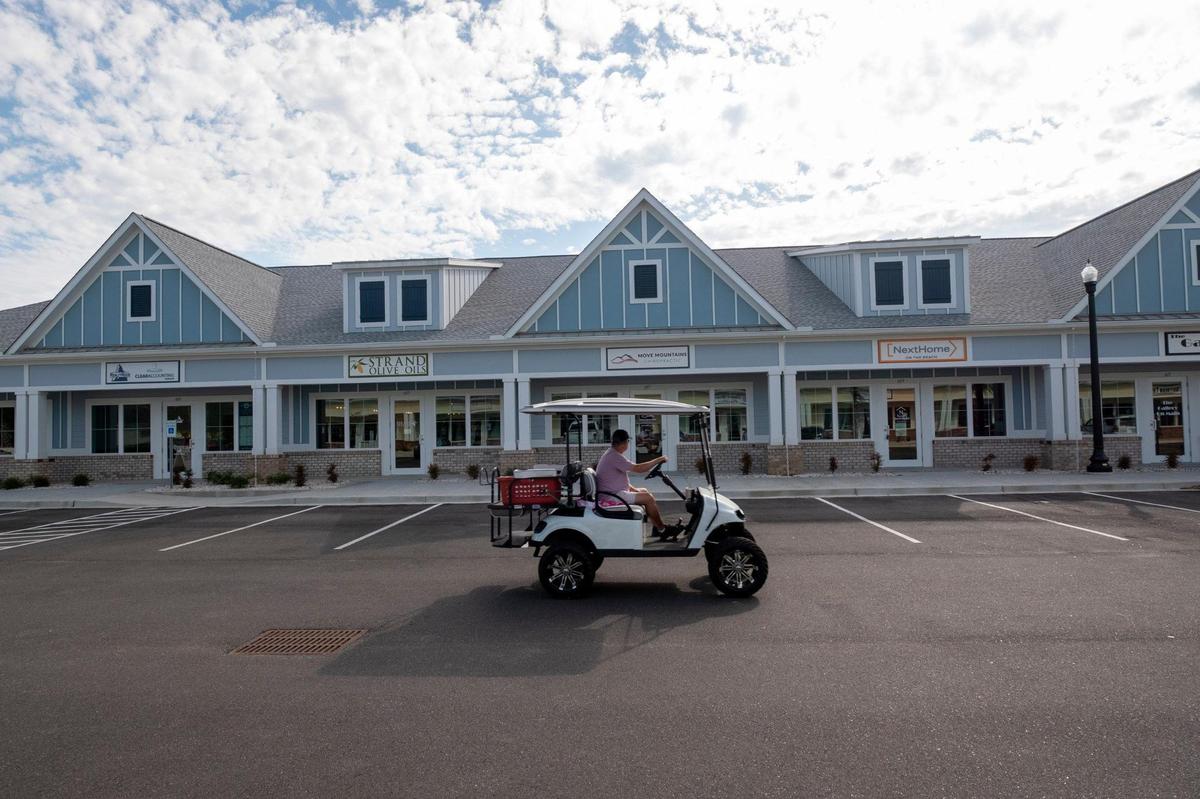 The Shops on Main shopping center on Main Street in North Myrtle Beach has 31 businesses in seven cottage-style buildings and more than 200 parking spaces on a six-acre piece of land. The center has retail businesses, services and restaurants.April 14, 2021.