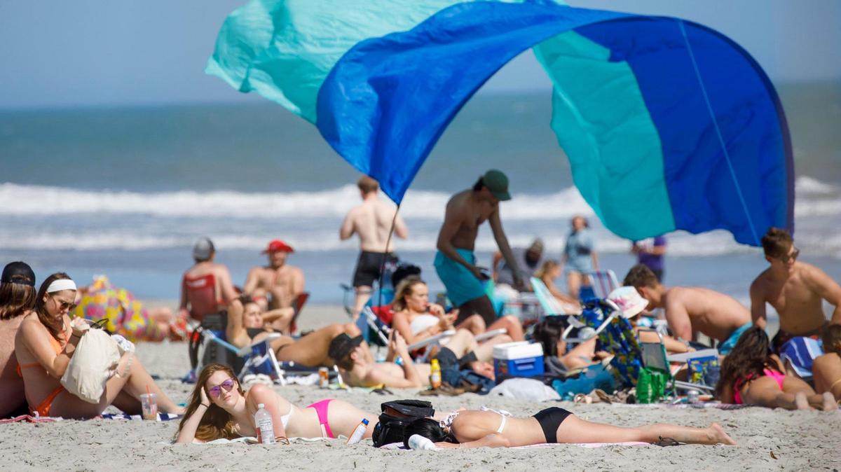 Spring Break students from area colleges enjoy the early Spring like weather on Surfside Beach. March 07, 2022.