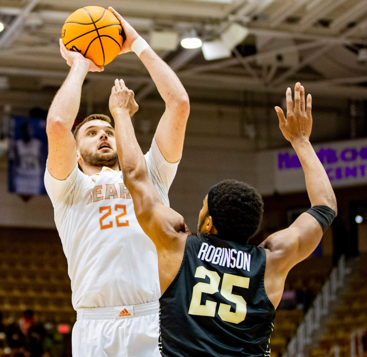 Mercer senior forward Felipe Haase shoots against West Carolina junior forward Marlow Gilmore Friday night during the SoCOn Ingle Basketball Championships at the Harrah’s Cherokee Center in Asheville, N.C.