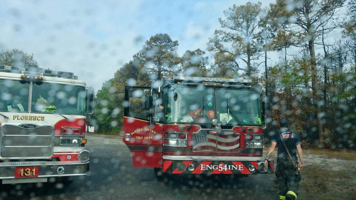 Some much needed rain begins to fall on Florence and Greenville, SC area fire engines and crews in the Reserve at Walkers Woods on Wednesday. Firefighters continue to battle a wildfire in Carolina Forest in the Myrtle Beach area. March 5, 2025
