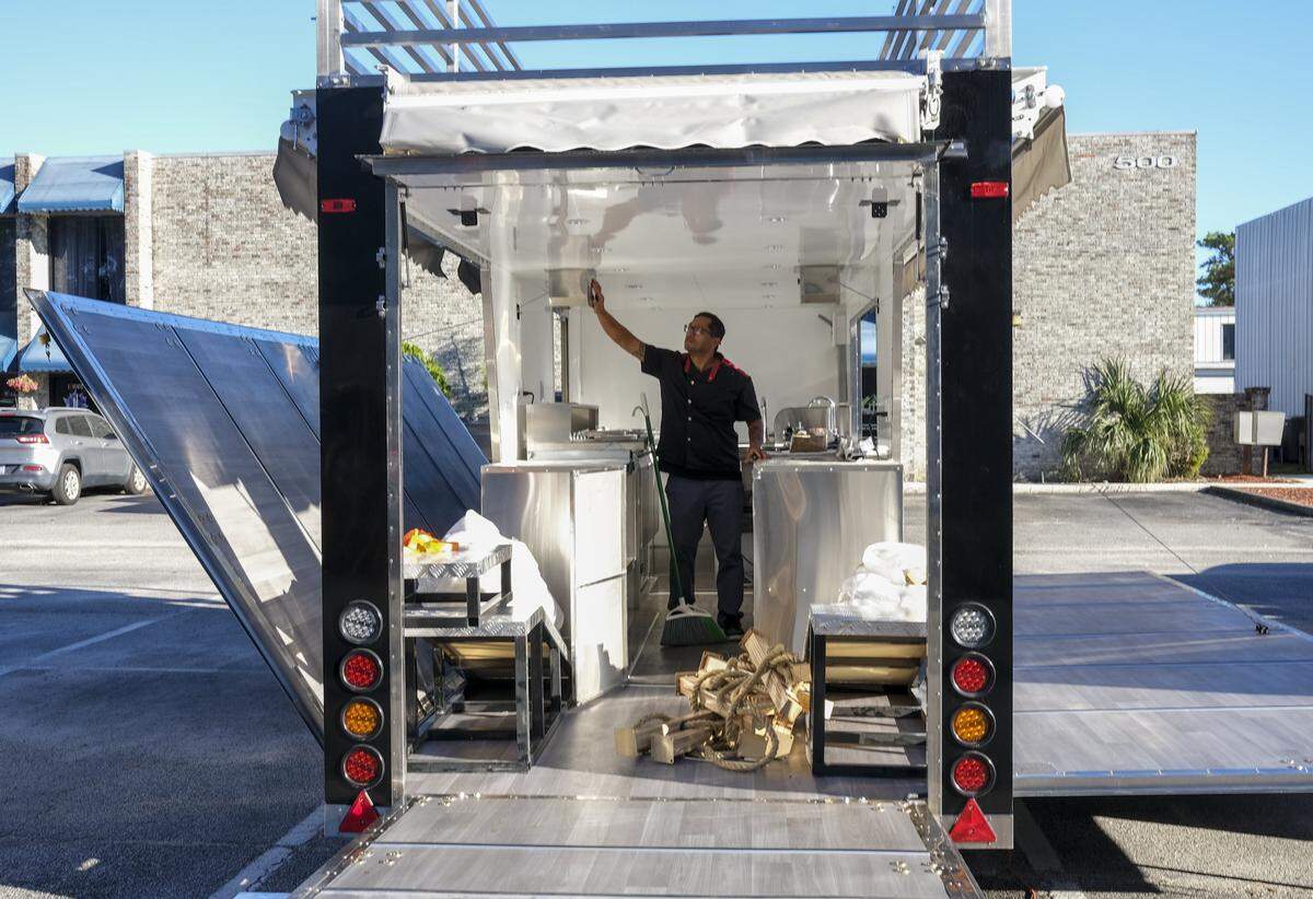 Ben Chong, partner in the Dojo Flavor Academy shows off a new food truck the GringoNinja plans to provide for future events. The owners of GringoNinja Private Chef Service are opening a physical space to host cooking classes and community workshops called The Dojo Flavor Academy located on Wesley Street in Myrtle Beach, SC. Tuesday, Nov. 11, 2025.