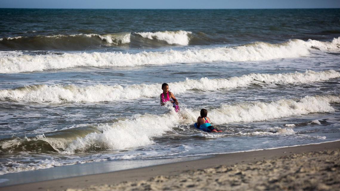 Aubrey and Yasmine of Knoxville, Tenn. play in the ocean off of 10th Avenue North in Myrtle Beach, S.C. On Tuesday, May 29 the epartment of Health and Environmental Control issued a swimming advisory for Horry County due to heightened bacteria levels in the ocean caused by the amount of rainfall associated with Tropical Storm Alberta.