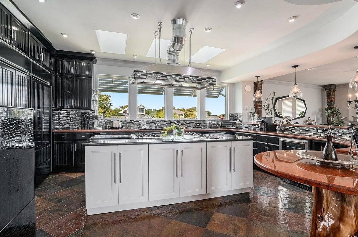 The kitchen of the 5729 Ocean Boulevard North house is outfitted with Thermador Professional appliances.