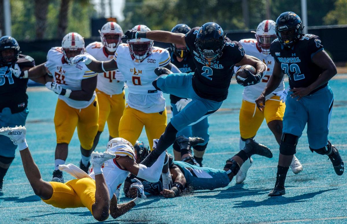 Coastal’s Reese White jumps defenders on Saturday. The No. 16 Coastal Carolina University Chanticleers college football team defeated Louisiana-Monroe Warhawks Saturday at Brooks Stadium in Conway, SC. Oct. 2, 2021.
