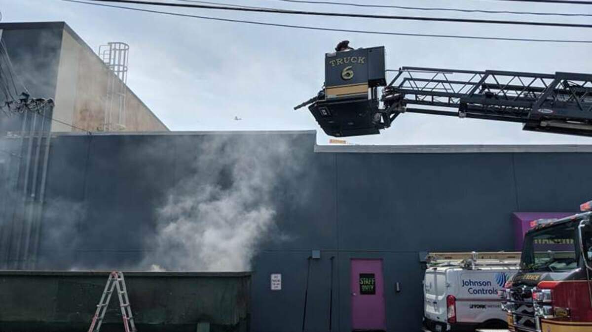A dumpster fire being put out by Myrtle Beach Fire Rescues.