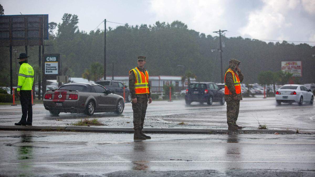 State troopers and other safety personnel direct traffic at the corner of U.S. 501 and S.C. 544 in Conway on Tuesday.