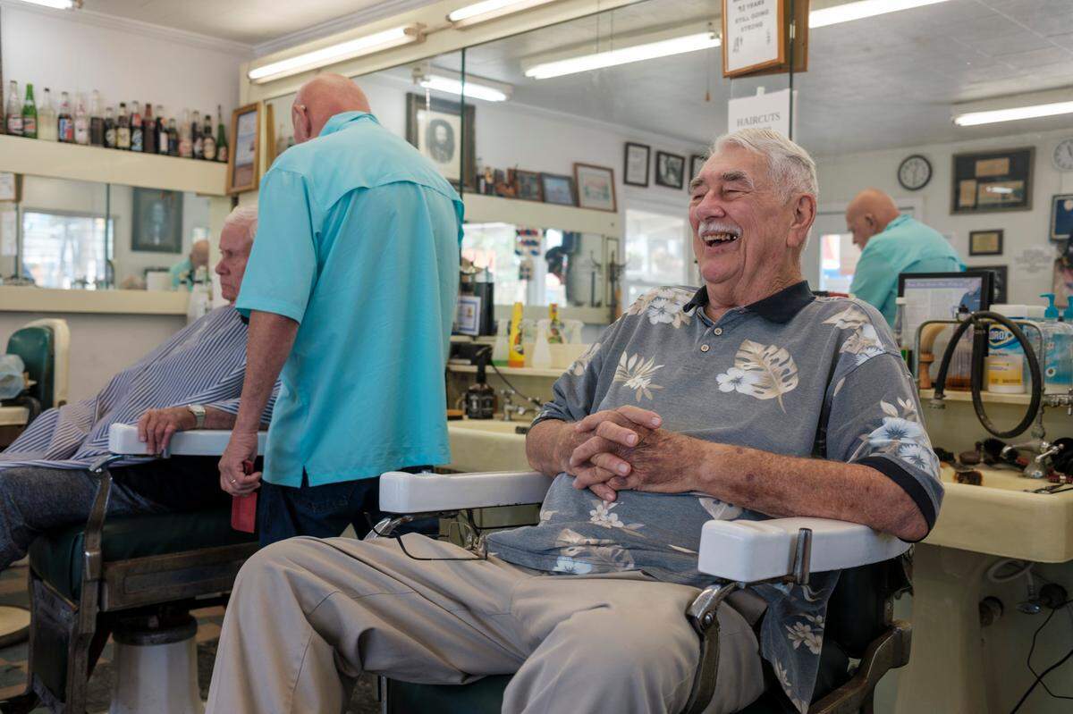 Bobby Lewis, age 82, got his start shining shoes and sweeping the floors in his father’s barber shop that was opened in 1952. Ocean Drive Barber Shop has been. The barber shop is recognized as being one of the oldest in the state. His brother and partner, Lynwood Lewis, worked beside him cutting hair until he retired a few years ago. Sept. 25, 2023.