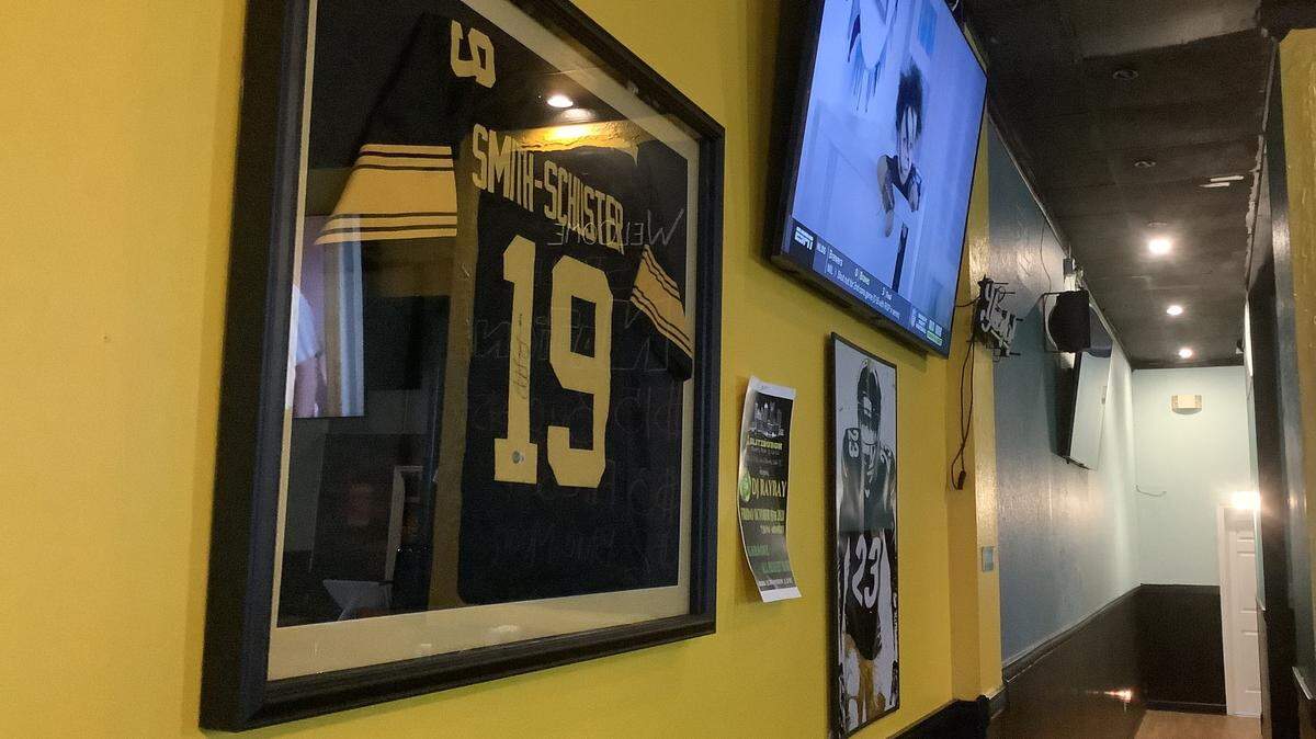 Pittsburgh Steelers jerseys signed by JuJu Smith-Schuster and Alan Faneca are among the memorabilia on the walls of the Blitzburgh sports bar in Murrells Inlet.