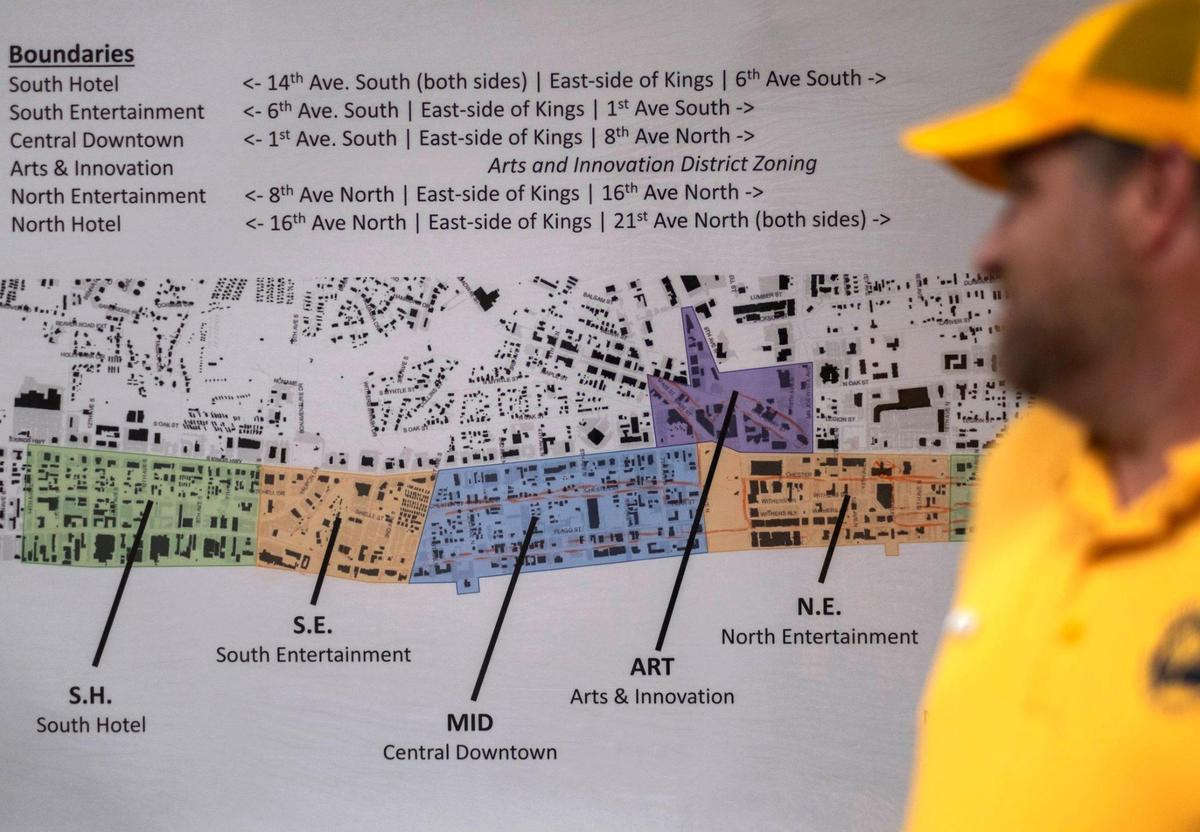 Joel Trout looks over a map of his team’s service area before dispatching Gold Cap Ambassadors to clean the streets Saturday morning. A dozen Gold Cap Ambassadors are now patrolling the streets of Myrtle Beach cleaning up trash, providing hospitality services, and reporting issues to city officials.The pilot program started in August as a way to improve the safety and cleanliness of the tourism district. August 26, 2020.