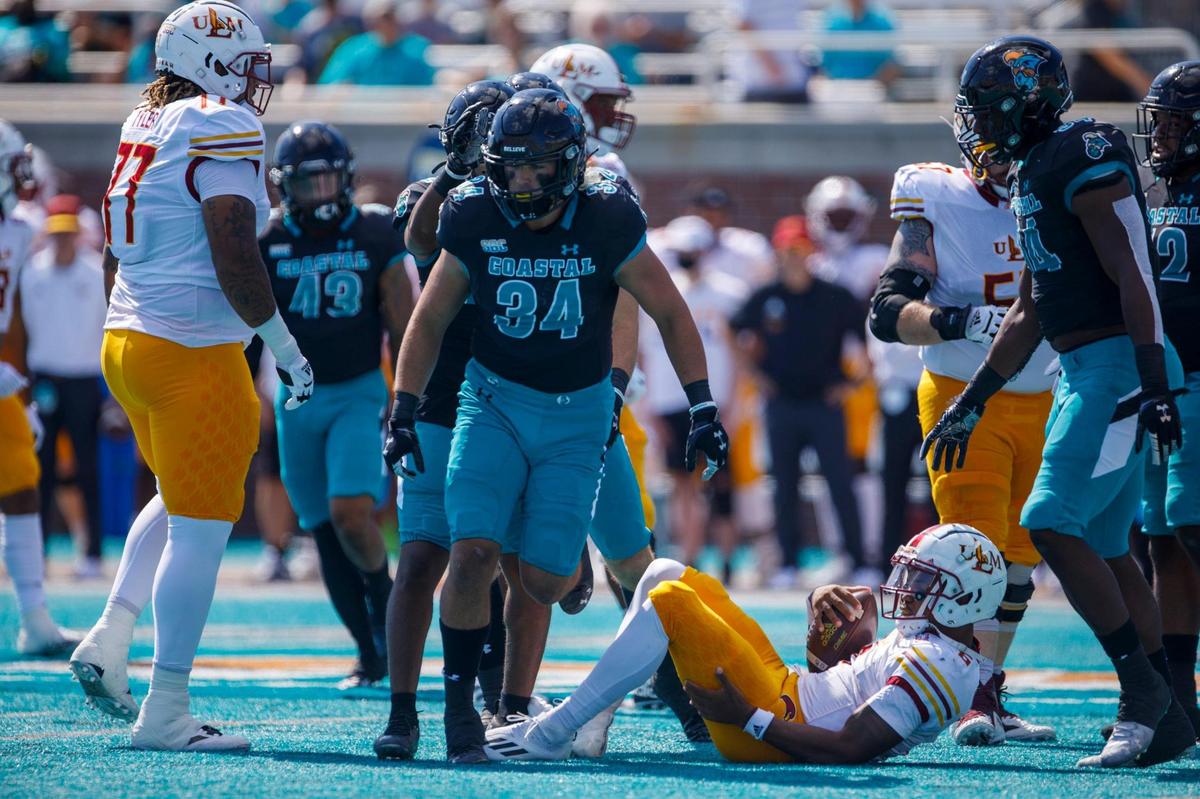 Coastal’s Teddy Gallagher celebrates after sacking ULM quarterback Chandler Rogers. The No. 16 Coastal Carolina University Chanticleers college football team defeated Louisiana-Monroe Warhawks Saturday at Brooks Stadium in Conway, SC. Oct. 2, 2021.