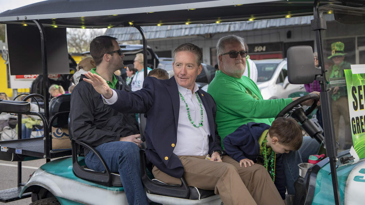 State senator Greg Hembree waves to onlookers as parade floats roll by along Main Street in North Myrtle Beach during the North Myrtle Beach St. Patrick’s Day parade in 2019.