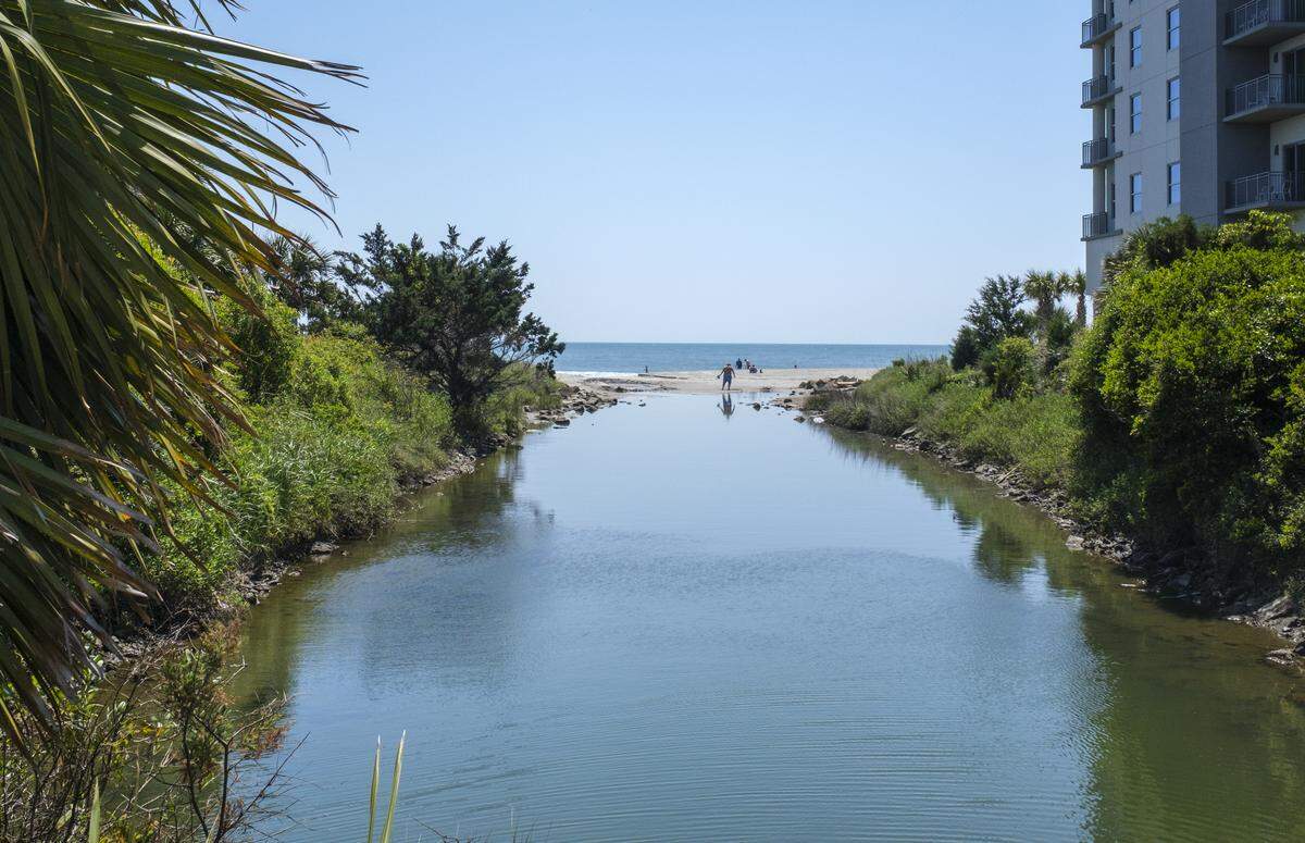 The Midway canal runs from the Myrtle Beach International Airport to the ocean outfall at 29th Avenue South in Myrtle Beach, SC. It carries storm water out to sea. April 23, 2026.