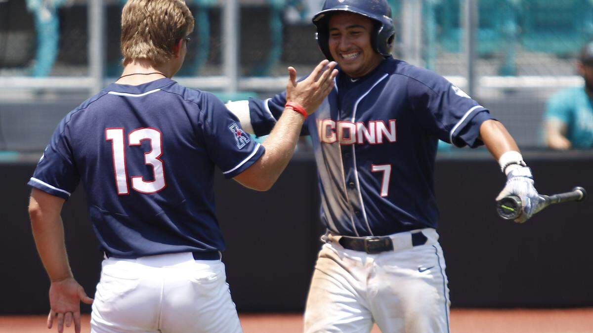 UConn's Anthony Nucerino (13) celebrates with Christian Fedko (7) after Fedko scored against LIU Brooklyn in the NCAA Conway Regional on Saturday at Springs Brooks Stadium.