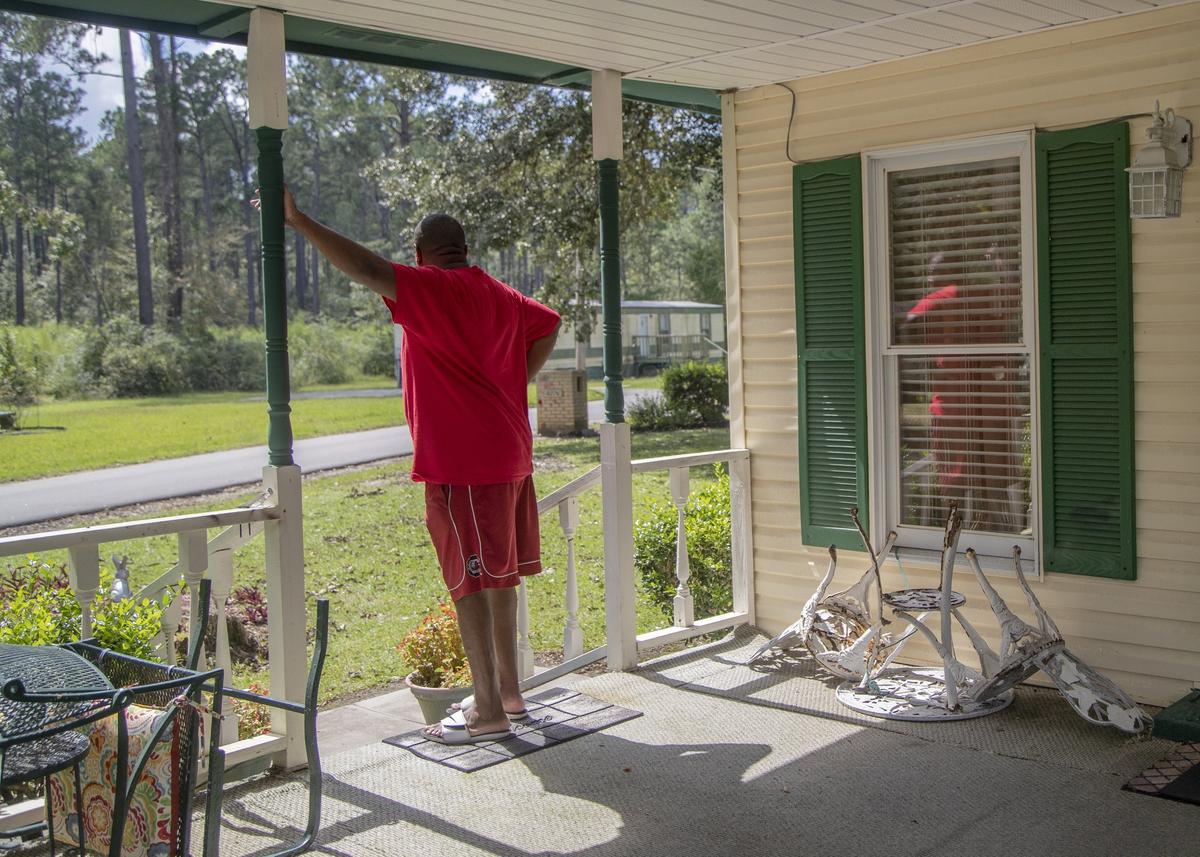 Ronnie Alston looks out from the front porch of his home Tuesday, Sept. 18, 2018, in Bucksport, SC. Alston’s home faces flooding from the Waccamaw and Great Pee Dee rivers.