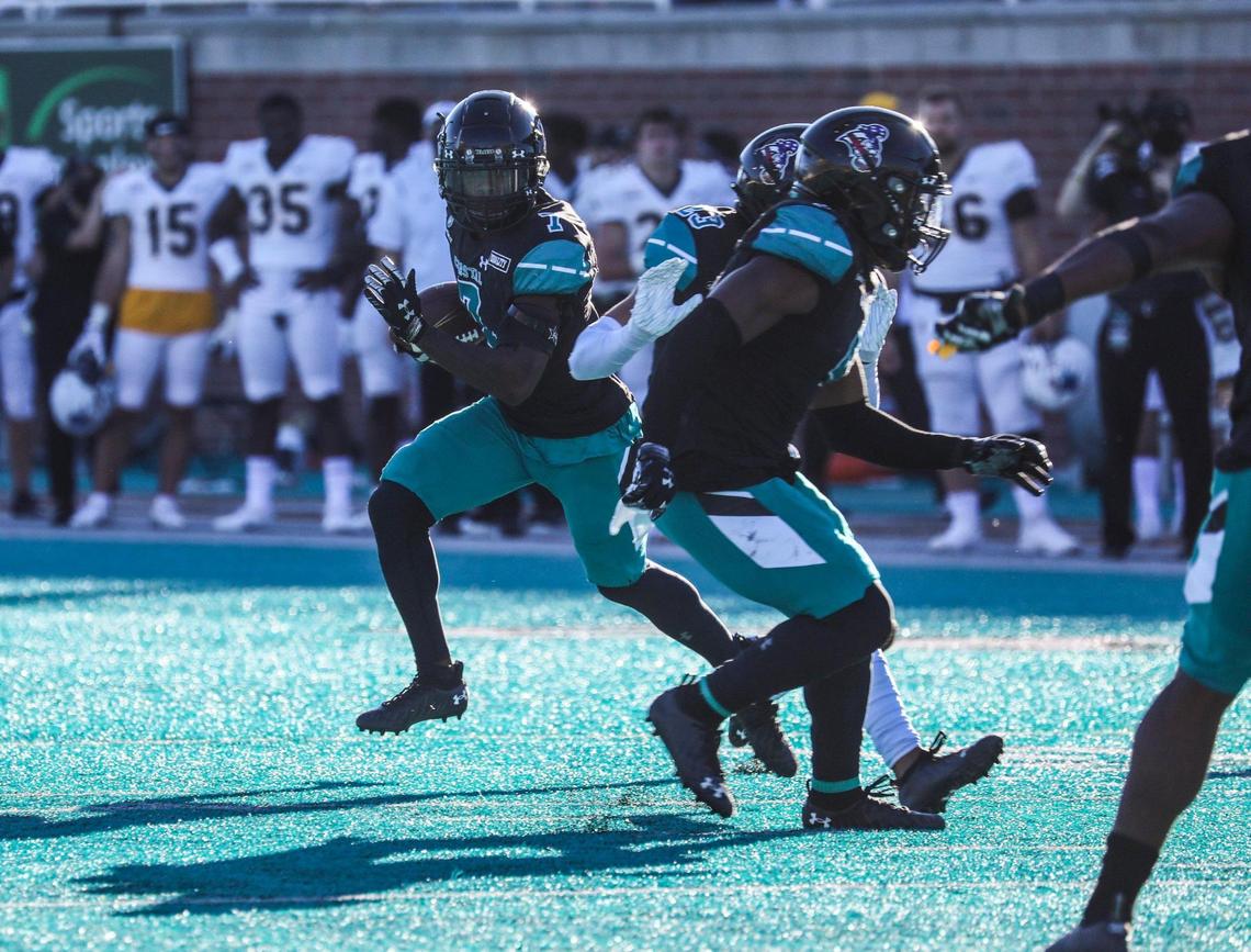 Coastal’s D’Jordan Strong runs back an interception to score against Appalachian State in the final minutes of the game Saturday. Coastal Carolina played Appalachian State with first place in the Sun Belt Conference’s East Division on the line Saturday at Brooks Stadium in Conway. Nov. 21, 2020.