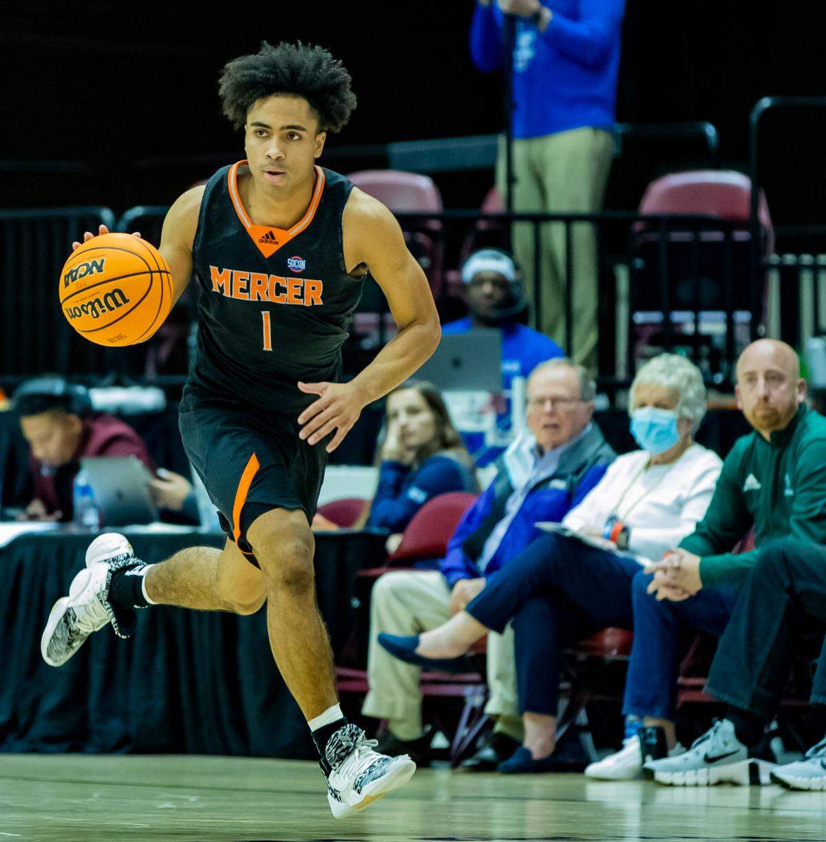 Mercer junior guard Kamar Robertson brings the ball down the court against Furman Saturday afternoon in the SoCon Ingles Basketball Championships at the Harrah’s Cherokee Center in Asheville, N.C.