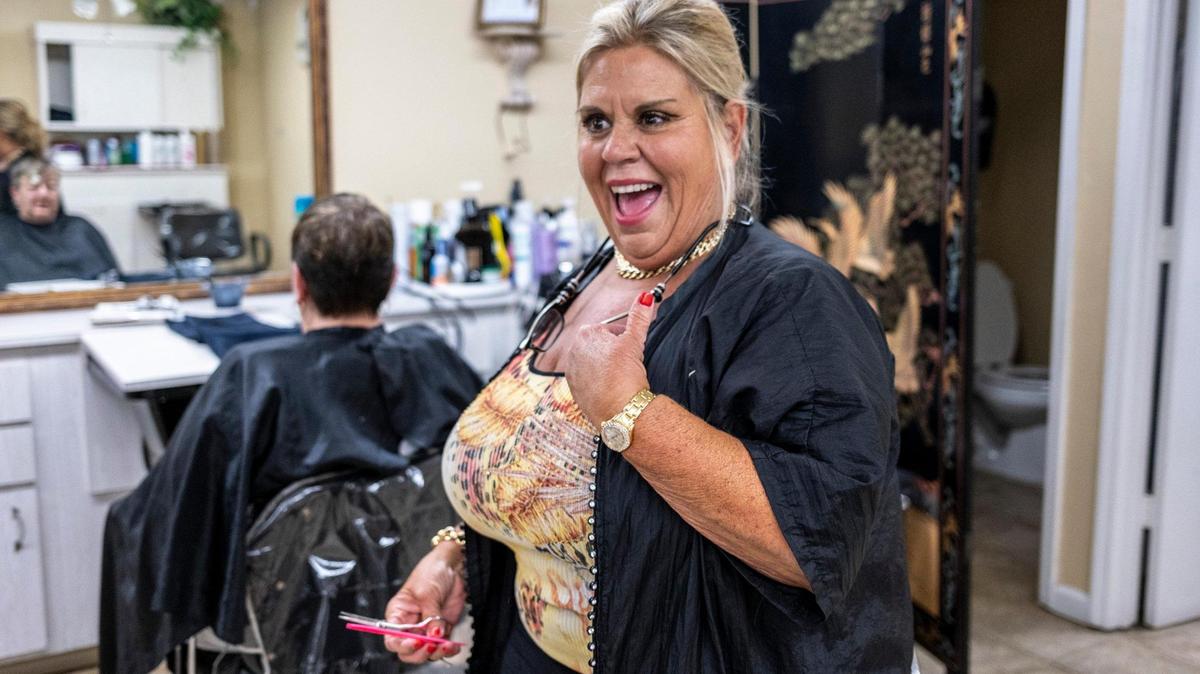 Gina Shelley styles hair at La Petite Hair Salon in Myrtle Beach. Shelley co-owned Tangulls Hair Salon in the reality television show “Welcome to Myrtle Manor” filmed from 2012-2015 in Patricks Mobile Home Park. July 19, 2023.