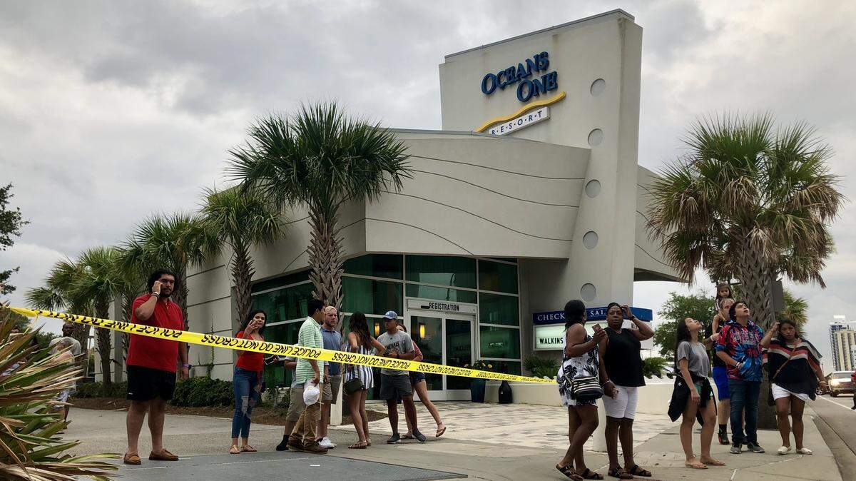 A crowd gathers at Oceans One Resort after Myrtle Beach Police responded on Saturday evening.