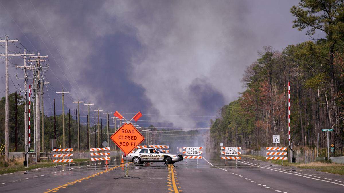 A controlled burn off International Drive has the road closed on Monday, March 18, 2019.