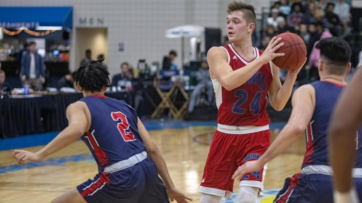 Myrtle Beach Christian Academy’s Michael Green looks to pass as the Saints take on Archbishop Stepinac (N.Y.) Wednesday during the Beach Ball Classic at the Myrtle Beach Convention Center.