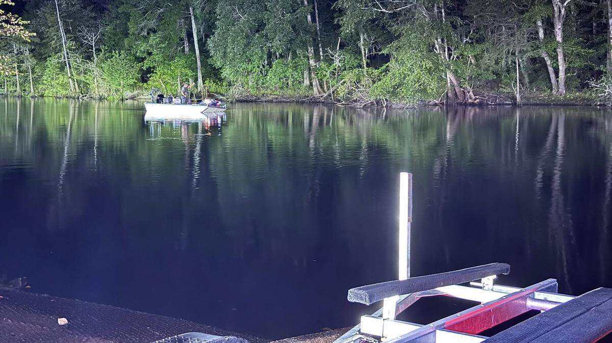 Horry County Fire Rescue dive teams help search for a vehicle Monday night, July 7, 2025. The driver of the vehicle led Horry County Police on a chase before driving off of Pitts Boat Landing and crashing into the Little Pee Dee River.