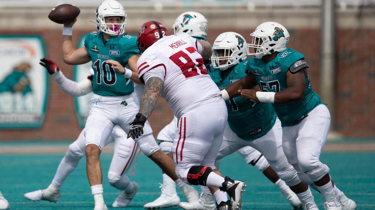 Coastal Carolina redshirt freshman quarterback Grayson McCall is pressured by Arkansas State. McCall was named the Sun Belt Conference Offensive Player of the Week for his performance in the game. CCU played the Red Wolves in its 2020 Sun Belt Conference football opener on Oct. 3 at Brooks Stadium in Conway.. October 3, 2020.