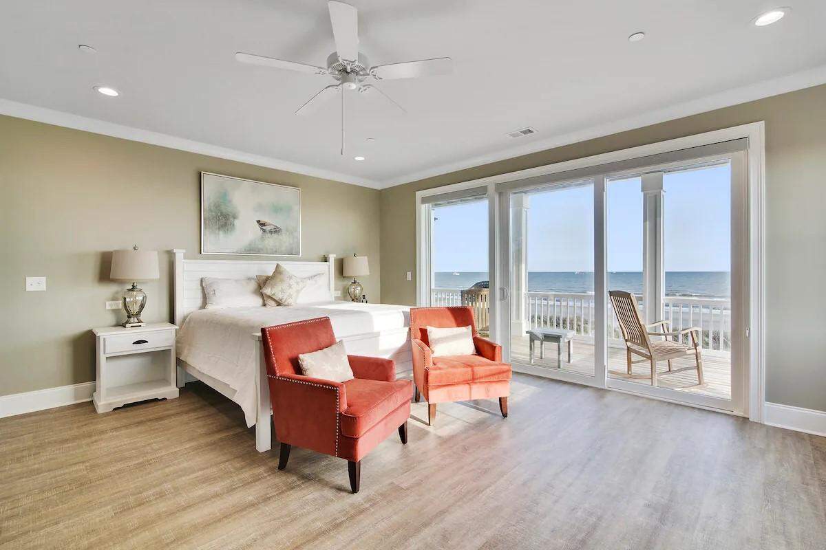 A bedroom in the Carlisle. It has a king bed and an ocean view.