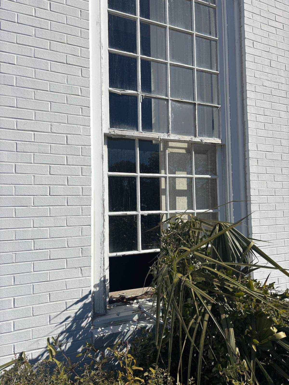 A broken window looking into the former First Presbyterian Church in downtown Myrtle Beach. A Winston-Salem company bought the building to turn into a bar in 2023.