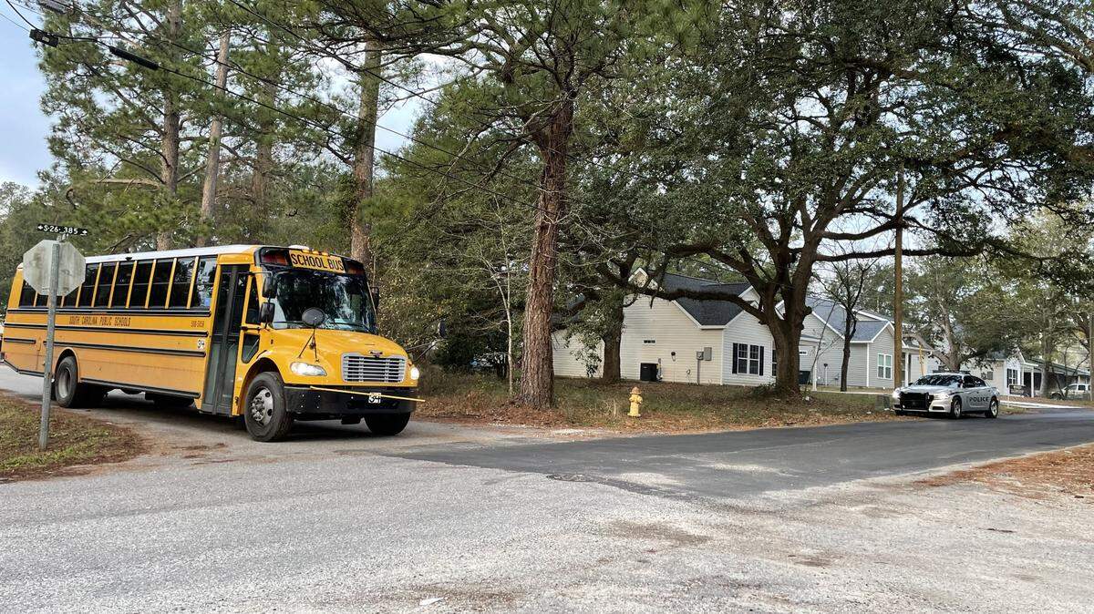 An Horry County Schools bus pulls up to the intersection of Rufus Street and Eighth Avenue in Conway on Feb. 2, 2024. An 18-year-old Carolina Forest High School student was shot and killed at the intersection Feb. 1, 2024, while waiting for the bus. He has now been connected to a January killing.