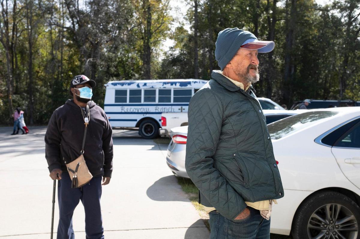 John Robert Cassity and Frederick Williamson, both residents of the Recovery Ranch, stand in line to vote at the Goretown Fire Station in Loris. Cassity was told he had to go to Conway to have place his ballot. Residents of the Recovery Ranch, a home for those struggling with homelessness and addiction, loaded a bus on Tuesday and traveled to polling places around the Horry County, S.C. in an attempt to vote. November 3, 2020.