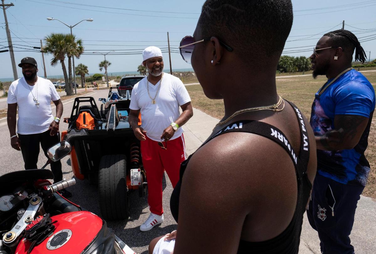 Lenny Brown of Long Island, N.Y. talks with fellow bikers on Atlantic Street where they arrived to find there were few bikers in Atlantic Beach which is normally the scene of a Memorial Day weekend festival. Small groups of bikers have arrived on the North end of the Grand Strand for Memorial Day weekend despite Atlantic Beach canceling it’s annual motorcycle festival for the second year due to COVID-19. May 27, 2021.