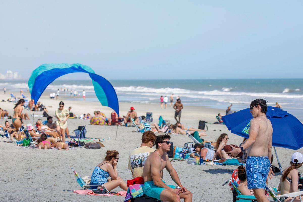 Spring Break students from area colleges enjoy the early Spring like weather on Surfside Beach. March 07, 2022.