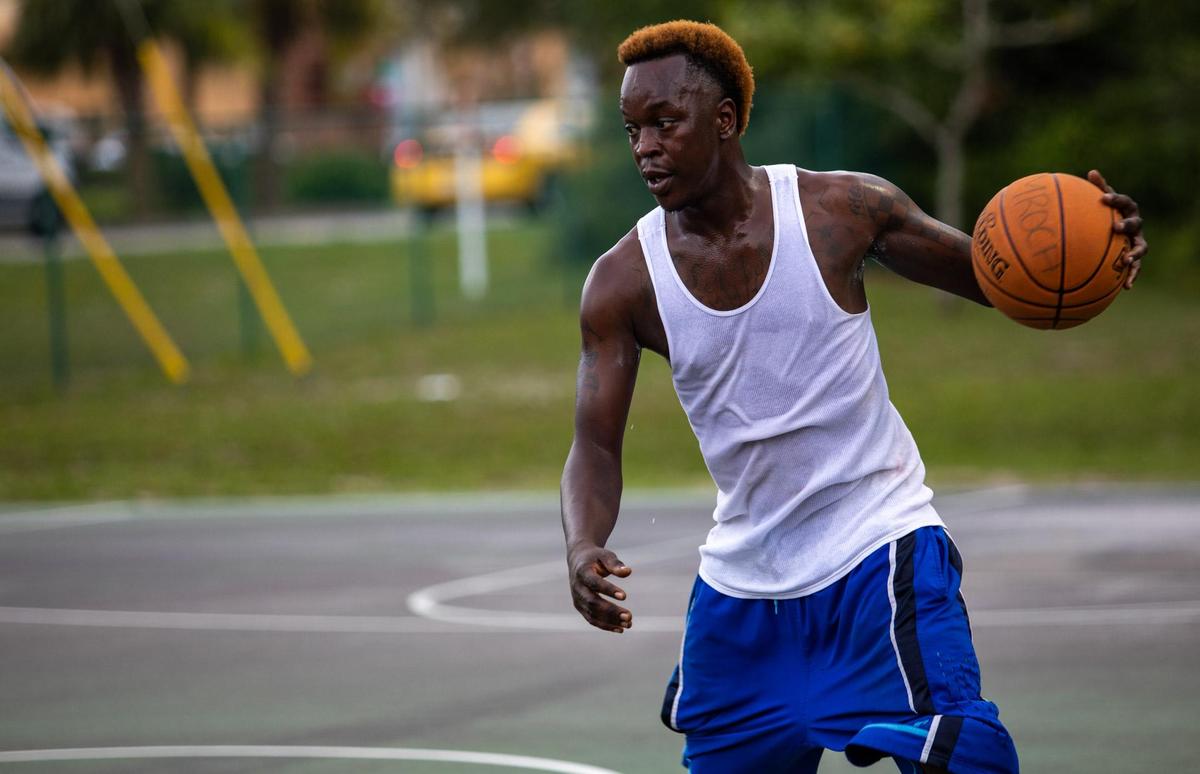 Marvin Lee participates in a game of pick-up basketball on the basketball court at Midway Park in Myrtle Beach Sunday afternoon.
