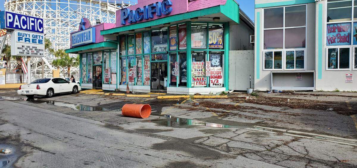 Tree and other debris sit outside a beachwear store along Ocean Boulevard and 4th Avenue South in Myrtle Beach.