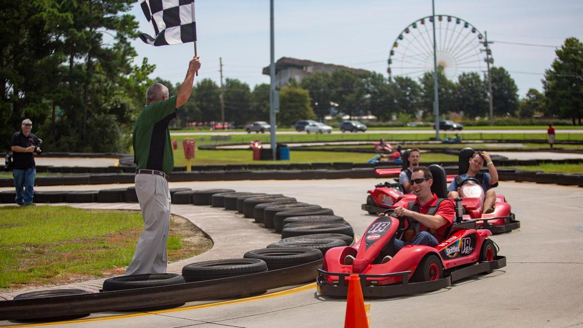 NASCAR driver and current points leader Kyle Busch races fans on a go-kart track at Broadway Grand Prix in Myrtle Beach on Aug. 7. Busch was in Myrtle Beach for the Grand Opening of the PALM Charter School in Conway.