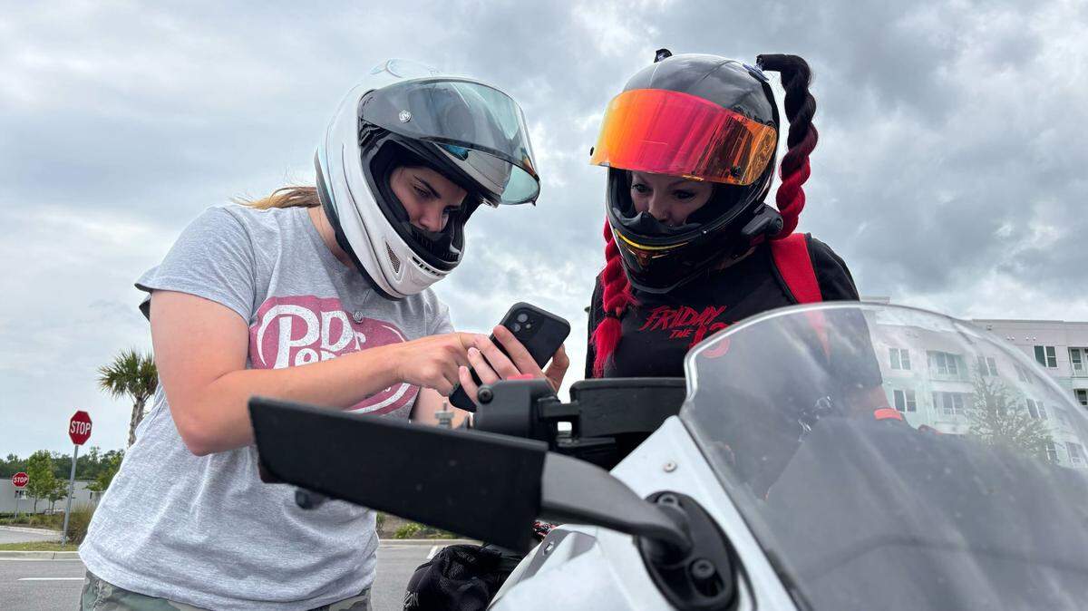 Aliyanna Lovett and Raven Bunton planning their motorcycle ride in Myrtle Beach. Lovett organizes women-only rides in the Myrtle Beach area.