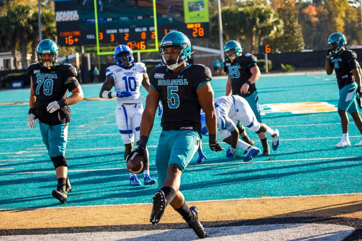 Coastal’s Sherri Jones trots into the end zone for a touchdown at the end of the first half on Saturday. Coastal Carolina University host Georgia State for homecoming on Saturday. Nov. 13, 2021.