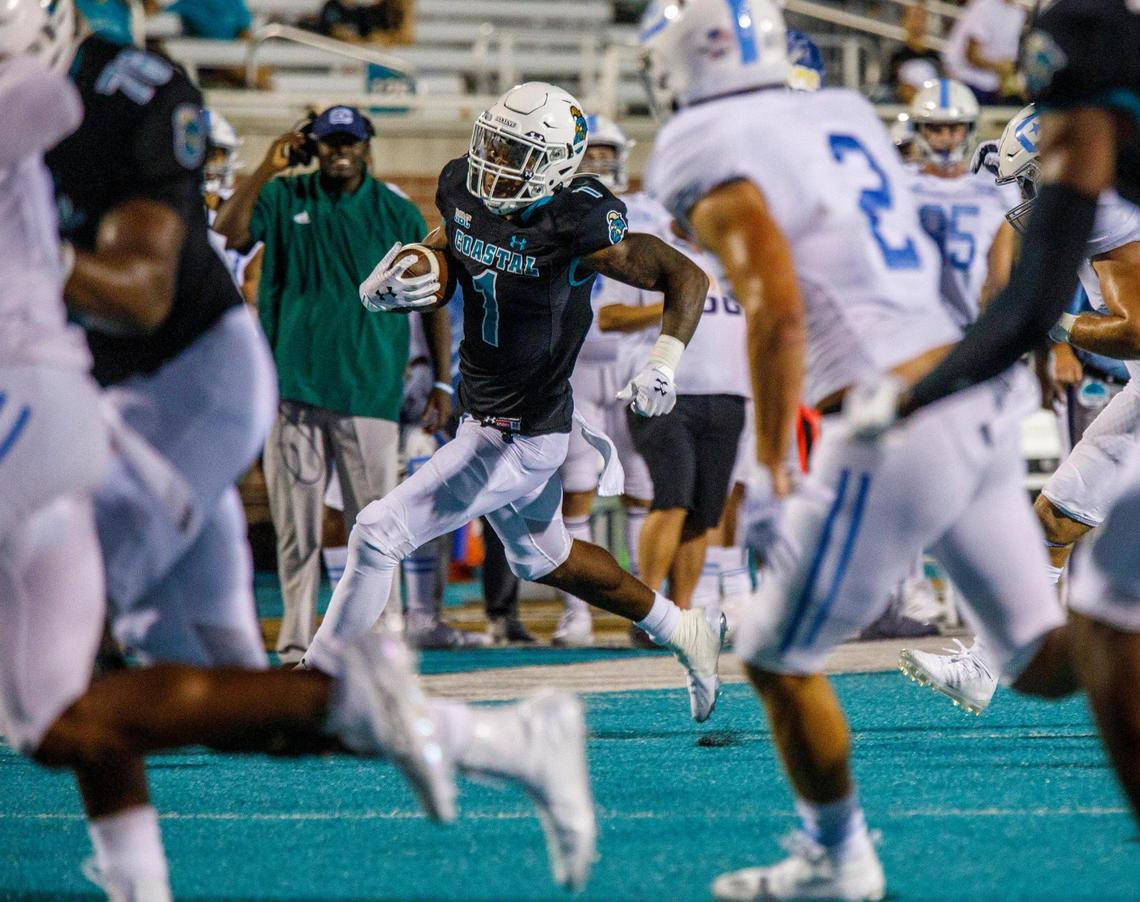 Braydon Bennett, runs the ball against The Citadel. Coastal Carolina University hosted The Citadel in game one of the 2021-22 season. Aug. 11, 2021.
