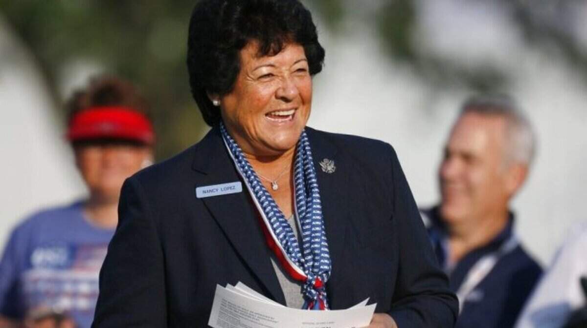 Nancy Lopez announces golfers during the first round of the inaugural U.S. Senior Women’s Open golf tournament in Wheaton, Ill., Thursday, July 12, 2018. (Daniel White/Daily Herald via AP)