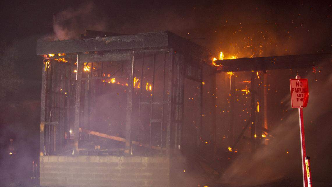 Myrtle Beach firefighters work to extinguish a fire ioff of 78th Ave. N. in Myrtle Beach Friday night.