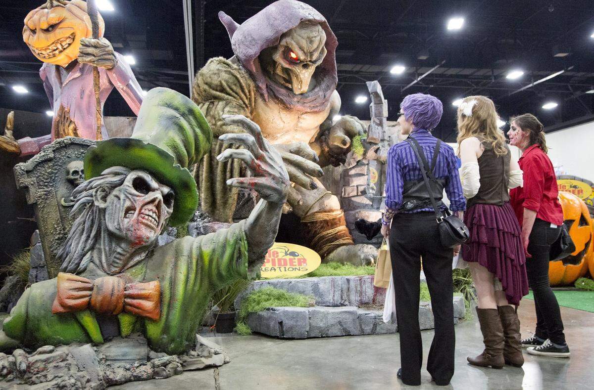 (L-R)Stephanie Frey, Lindsey Holt, and Amanda Frey admire Little Spider Creation’s sculptures at XCon world. The XCON World, an annual comic convention and show takes place May 15-17 at the Myrtle Beach Convention center. The show features an popular celebrity guests, writers, and artists, with participants often showing up in character costume. Three day admission is $25 per person with children under 12 years old getting in free.